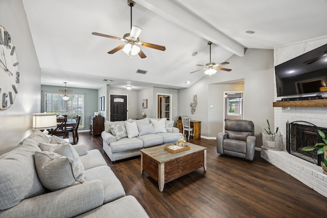 1502 Bette Dr, Mesquite, TX 75149 - living room featuring dark wood-style flooring, a ceiling fan, and a brick fireplace