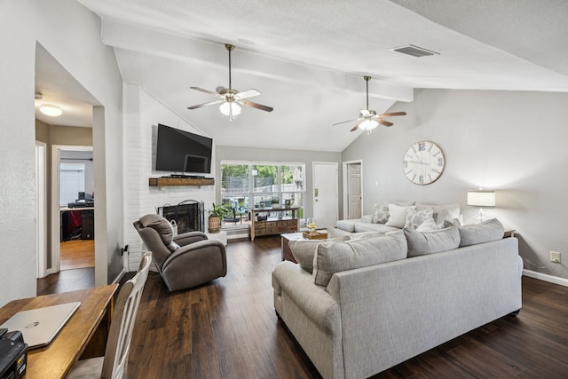 1502 Bette Dr, Mesquite, TX 75149 - living area featuring a fireplace, ceiling fan, and dark wood-style flooring