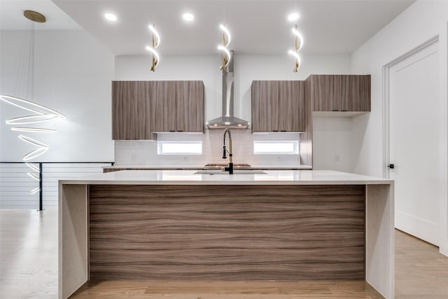 1521 N Haskell Ave, Dallas, TX 75204 - kitchen with modern cabinets, light countertops, and a center island with sink