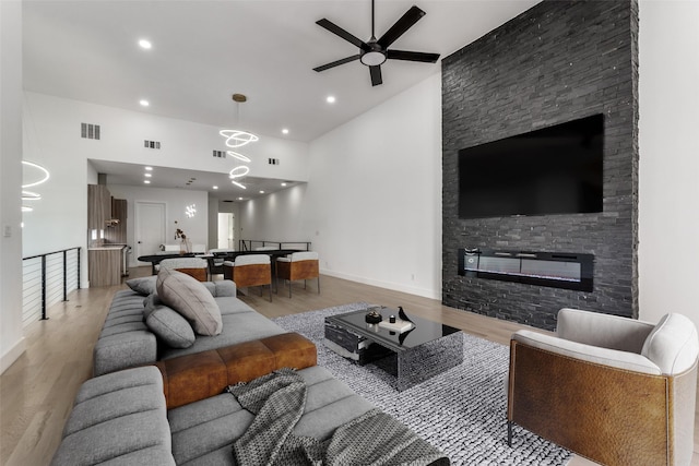 1521 N Haskell Ave, Dallas, TX 75204 - living area with a ceiling fan, light wood-style floors, a fireplace, recessed lighting, and high vaulted ceiling