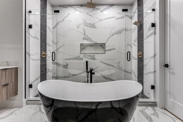 1521 N Haskell Ave, Dallas, TX 75204 - full bath with marble tiled floors, a soaking tub, and a marble finish shower
