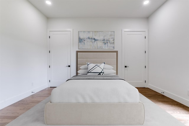 1521 N Haskell Ave, Dallas, TX 75204 - bedroom featuring recessed lighting and wood finished floors