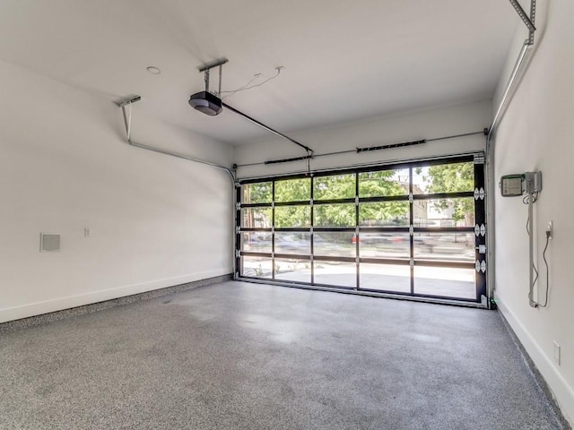 1521 N Haskell Ave, Dallas, TX 75204 - garage featuring baseboards and a garage door opener