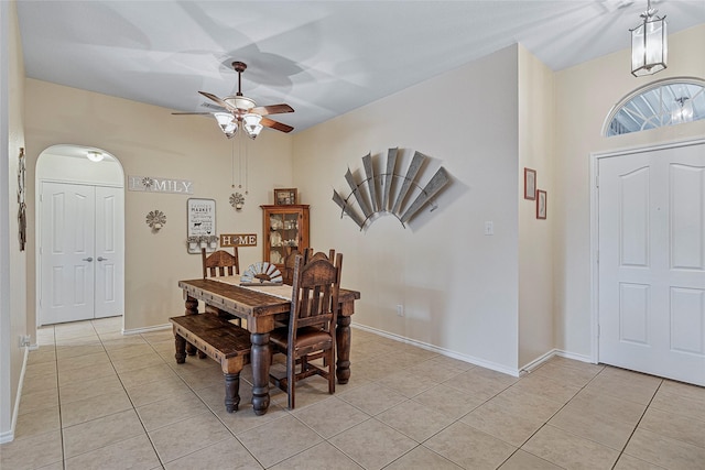 7807 Raton Ridge Ln, Arlington, TX 76002 - dining area with light tile patterned floors, ceiling fan, and arched walkways
