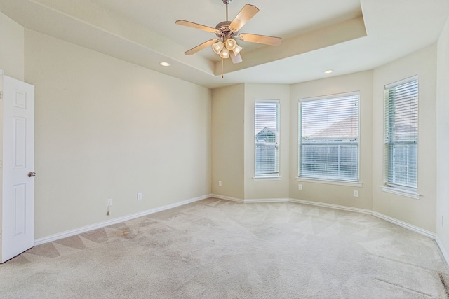 6602 Orange Blossom Dr, Midlothian, TX 76065 - spare room with light colored carpet, ceiling fan, recessed lighting, and a tray ceiling