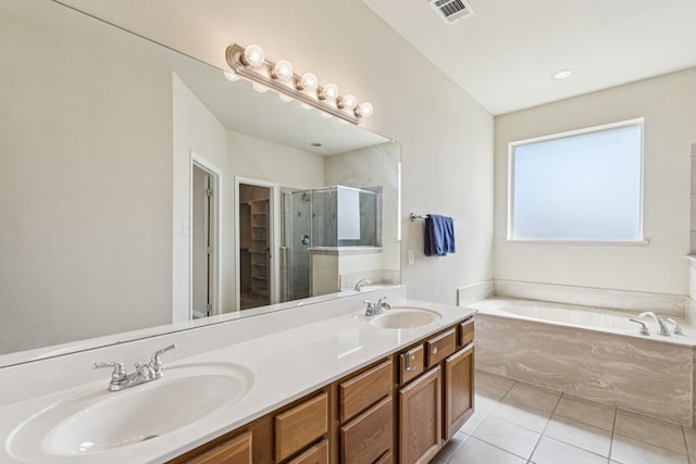 6602 Orange Blossom Dr, Midlothian, TX 76065 - full bath featuring a garden tub, a stall shower, tile patterned floors, double vanity, and a walk in closet