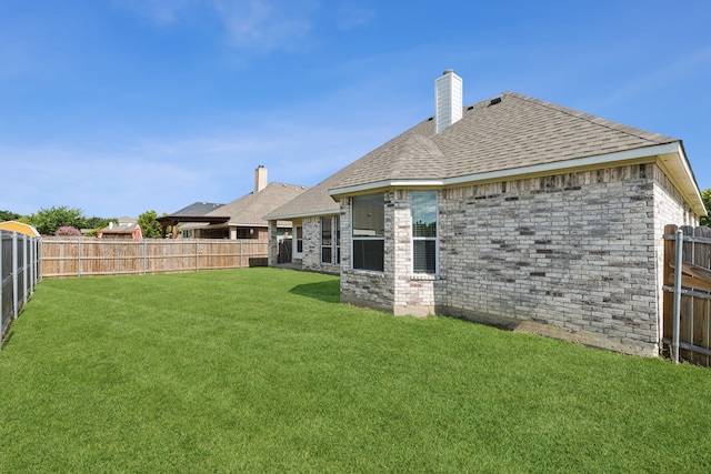 6602 Orange Blossom Dr, Midlothian, TX 76065 - rear view of house featuring a fenced backyard, a chimney, and roof with shingles