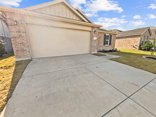 1409 Rivers Creek Ln, Little Elm, TX 75068 - ranch-style home with brick siding, concrete driveway, an attached garage, board and batten siding, and a front yard