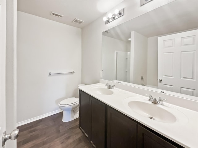 1409 Rivers Creek Ln, Little Elm, TX 75068 - bathroom featuring wood finished floors and double vanity