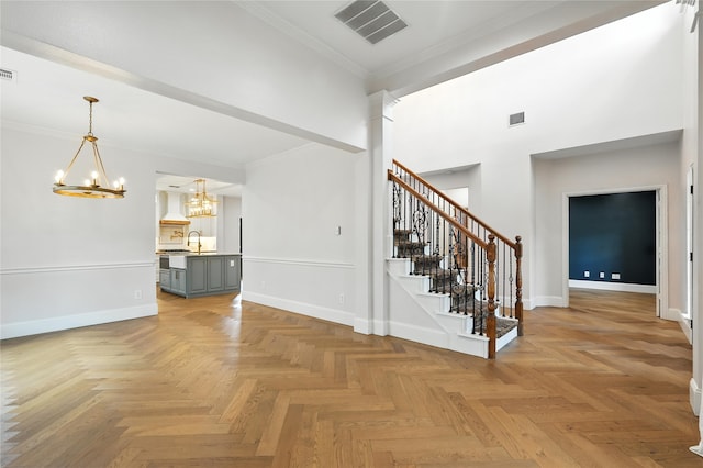 2705 Jackson Dr, Melissa, TX 75454 - entryway with a chandelier, stairway, a towering ceiling, and crown molding