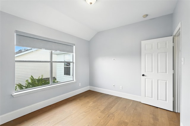 2705 Jackson Dr, Melissa, TX 75454 - empty room featuring vaulted ceiling, light wood-style flooring, and a smoke detector