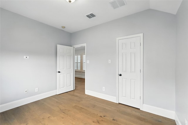 2705 Jackson Dr, Melissa, TX 75454 - unfurnished bedroom with wood finished floors and lofted ceiling