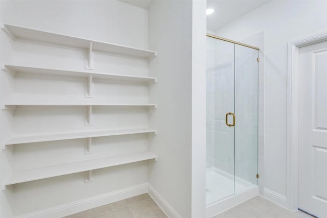 304 Ridge Dr, Justin, TX 76247 - bathroom featuring a shower stall and tile patterned flooring