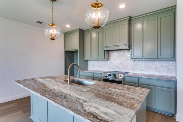 304 Ridge Dr, Justin, TX 76247 - kitchen featuring stainless steel electric range oven, decorative backsplash, light stone countertops, dark wood finished floors, and recessed lighting