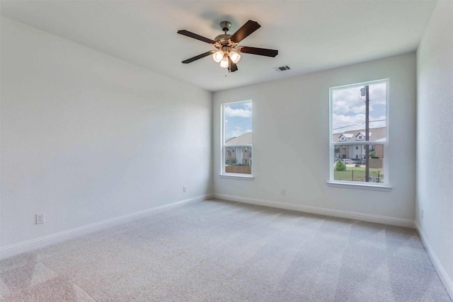 304 Ridge Dr, Justin, TX 76247 - unfurnished room with plenty of natural light, light colored carpet, and ceiling fan