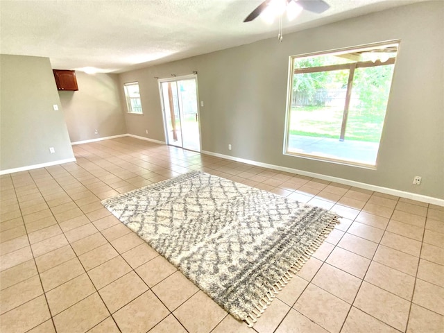 6509 Woodway Dr, Fort Worth, TX 76133 - spare room featuring light tile patterned floors, a ceiling fan, and a textured ceiling