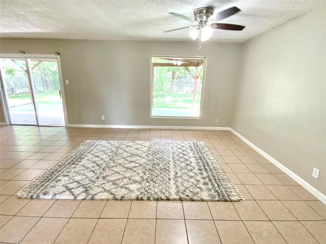 6509 Woodway Dr, Fort Worth, TX 76133 - spare room with a textured ceiling, tile patterned flooring, and ceiling fan