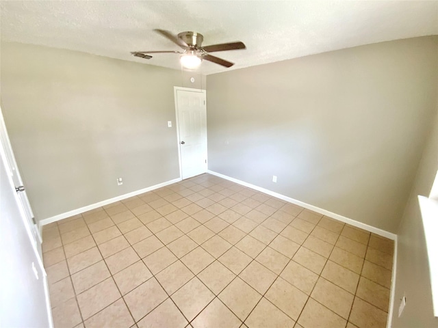 6509 Woodway Dr, Fort Worth, TX 76133 - empty room with ceiling fan, light tile patterned floors, and a textured ceiling