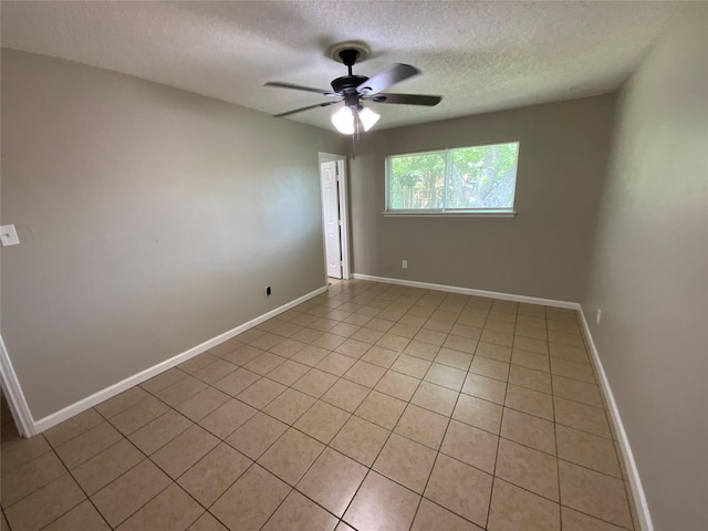 6509 Woodway Dr, Fort Worth, TX 76133 - spare room with a textured ceiling, ceiling fan, and light tile patterned flooring