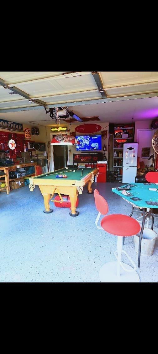 2293 Heatherdale Dr, Mesquite, TX 75150 - game room featuring pool table, speckled floor, and a garage
