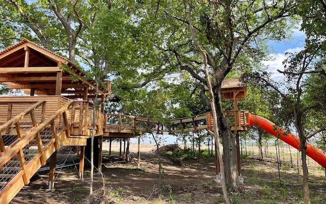1805 Tree House Trl, Mesquite, TX 75181 - view of jungle gym with stairway and a wooden deck