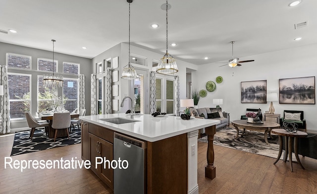 1805 Tree House Trl, Mesquite, TX 75181 - kitchen featuring stainless steel dishwasher, dark wood-type flooring, open floor plan, light countertops, and recessed lighting