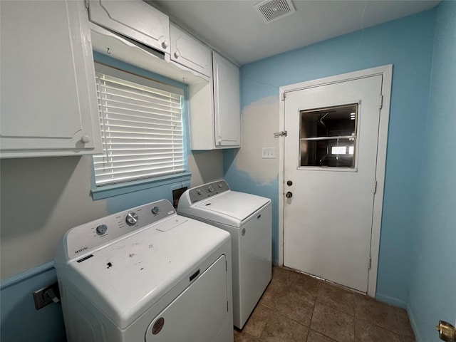 1726 Crescent Dr, Sherman, TX 75092 - washroom with cabinet space, washing machine and dryer, and dark tile patterned flooring