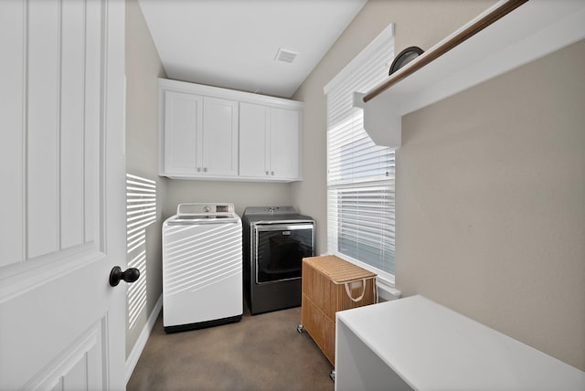 940 E 5th St, Springtown, TX 76082 - washroom with washer and dryer and cabinet space