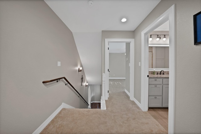 940 E 5th St, Springtown, TX 76082 - hall featuring an upstairs landing and carpet flooring