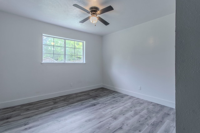 10029 Grove Oaks Blvd, Dallas, TX 75217 - spare room featuring a ceiling fan and wood finished floors