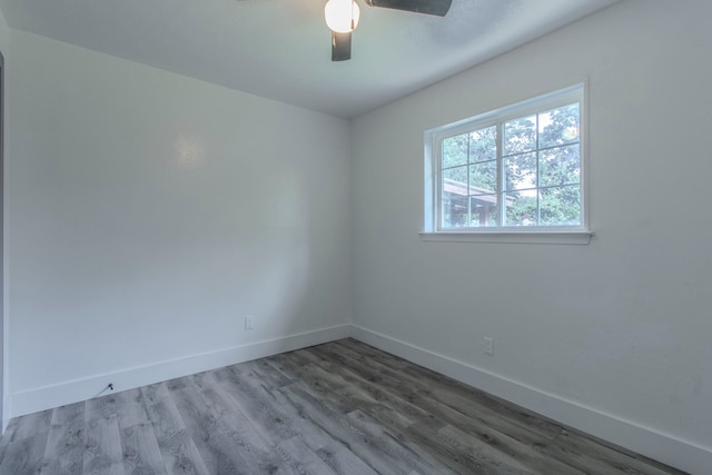 10029 Grove Oaks Blvd, Dallas, TX 75217 - empty room with wood finished floors and ceiling fan