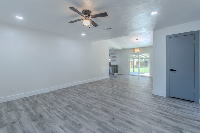 10029 Grove Oaks Blvd, Dallas, TX 75217 - unfurnished living room featuring a ceiling fan, light wood-type flooring, and recessed lighting