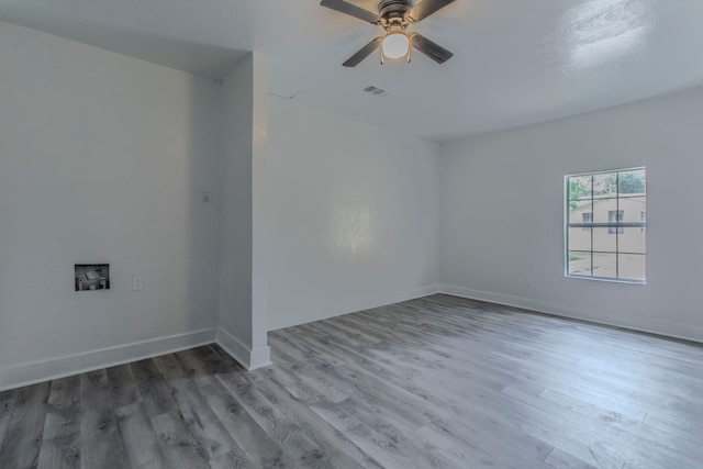 10029 Grove Oaks Blvd, Dallas, TX 75217 - empty room with wood finished floors and ceiling fan