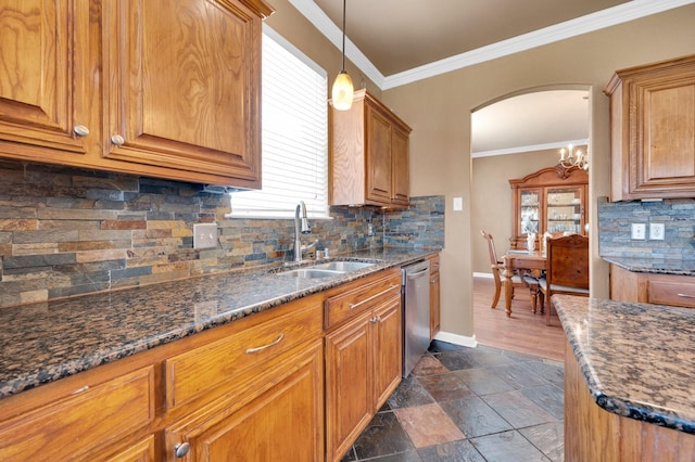 701 Champlain Ct, Midlothian, TX 76065 - kitchen with arched walkways, brown cabinets, dishwasher, and ornamental molding