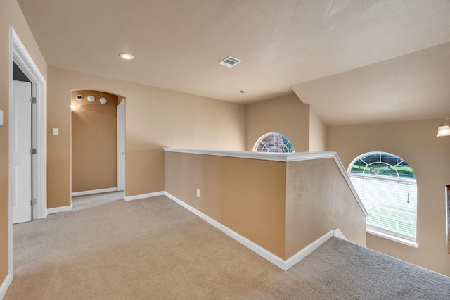 701 Champlain Ct, Midlothian, TX 76065 - corridor with an upstairs landing, carpet, arched walkways, and recessed lighting