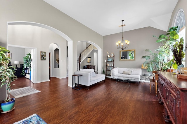 236 Hope Cir, Murphy, TX 75094 - living area with arched walkways, wood finished floors, a chandelier, and high vaulted ceiling