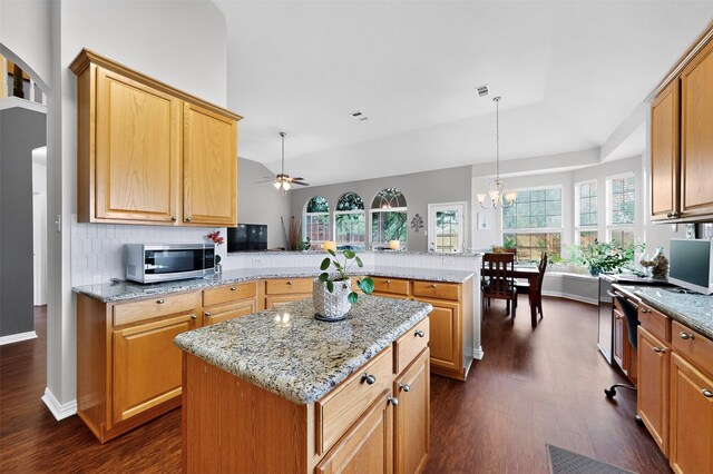 236 Hope Cir, Murphy, TX 75094 - kitchen with stainless steel microwave, a peninsula, dark wood finished floors, ceiling fan, and vaulted ceiling