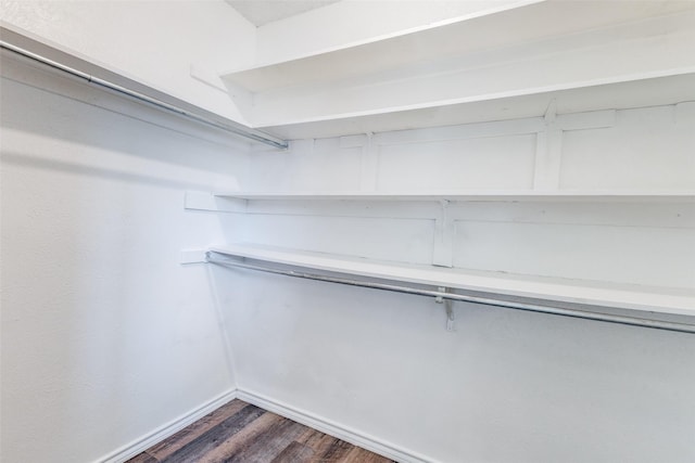 1308 Choctaw Dr, Mesquite, TX 75149 - spacious closet featuring dark wood-style floors
