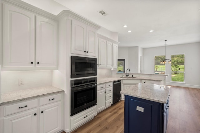 6417 Gehrig Cir, Burleson, TX 76028 - kitchen featuring oven, dishwashing machine, built in microwave, a peninsula, and decorative backsplash