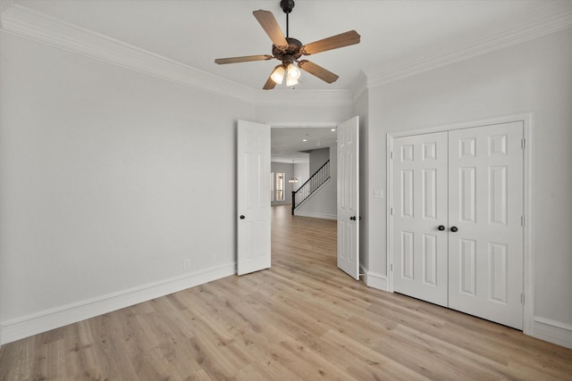6417 Gehrig Cir, Burleson, TX 76028 - unfurnished bedroom featuring ornamental molding, light wood finished floors, a closet, and ceiling fan