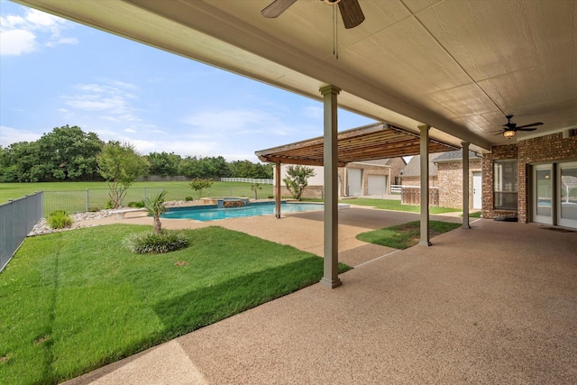 6417 Gehrig Cir, Burleson, TX 76028 - fenced backyard with ceiling fan, a patio area, a pool with connected hot tub, and an outdoor structure