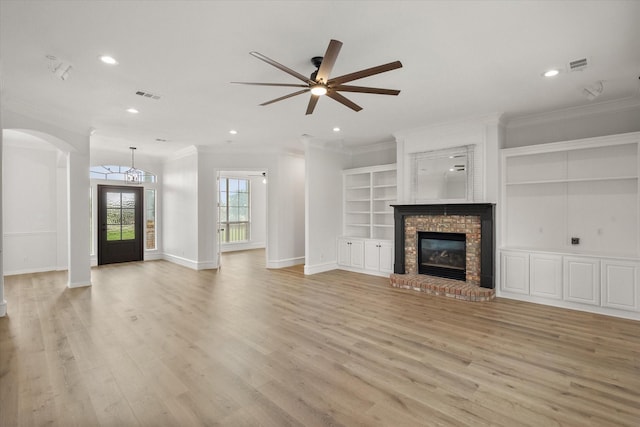 6417 Gehrig Cir, Burleson, TX 76028 - unfurnished living room featuring crown molding, light wood-style floors, a ceiling fan, recessed lighting, and a fireplace