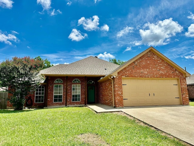 917 Calder St, Howe, TX 75459 - view of front facade with a garage, a front yard, driveway, a shingled roof, and brick siding