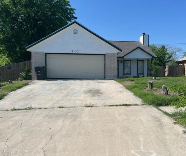 2100 Wheeler Ave, Killeen, TX 76549 - ranch-style house featuring brick siding, a garage, and driveway