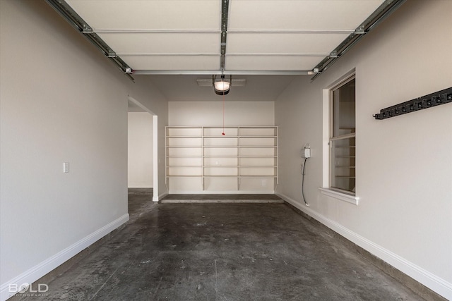 1030 Winterberry Ln, Shreveport, LA 71106 - garage featuring baseboards and a garage door opener