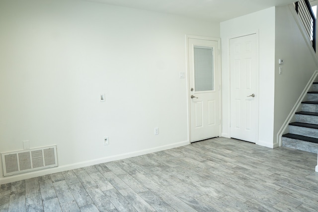 624 Mission Hills Dr, Arlington, TX 76018 - unfurnished room with stairway and light wood-style floors