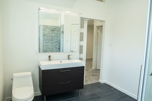 624 Mission Hills Dr, Arlington, TX 76018 - full bathroom with wood finished floors, vanity, and tiled shower
