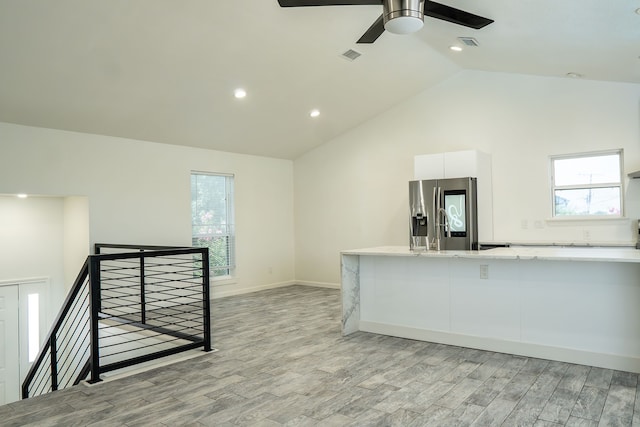 624 Mission Hills Dr, Arlington, TX 76018 - unfurnished living room with ceiling fan, lofted ceiling, healthy amount of natural light, light wood-style flooring, and recessed lighting