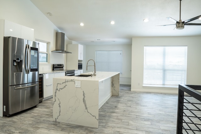624 Mission Hills Dr, Arlington, TX 76018 - kitchen featuring stainless steel appliances, wall chimney range hood, white cabinets, modern cabinets, and ceiling fan
