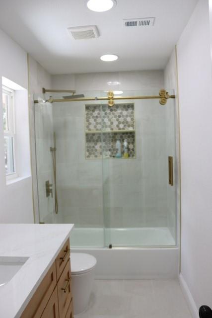 129 Oak Trl, Burleson, TX 76028 - bathroom with vanity, enclosed tub / shower combo, and tile patterned flooring